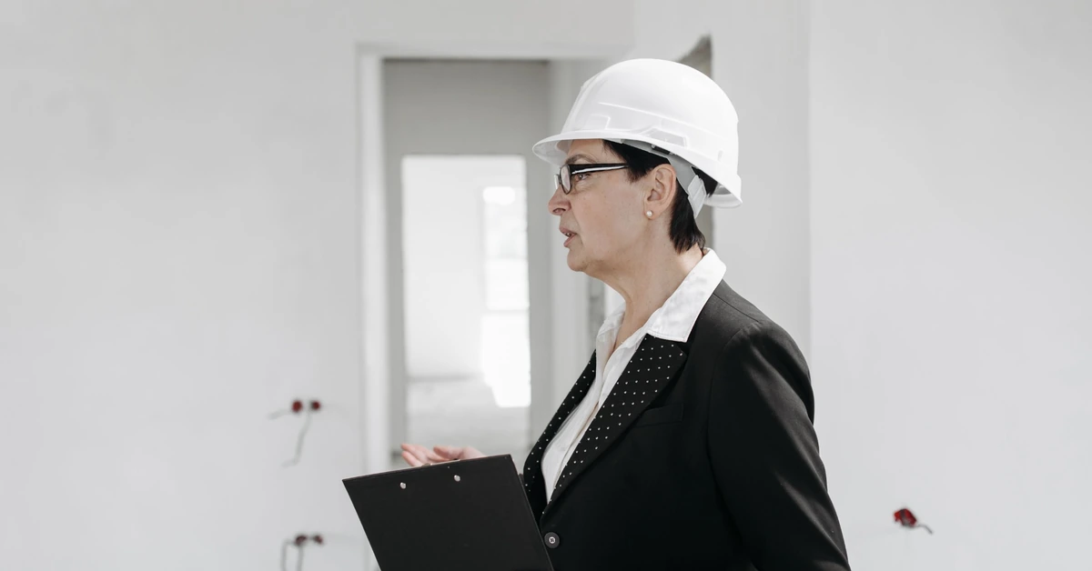 Engineer inspecting a construction site with a clipboard, illustrating the importance of checking an affiliate blog before sending more visitors to it.