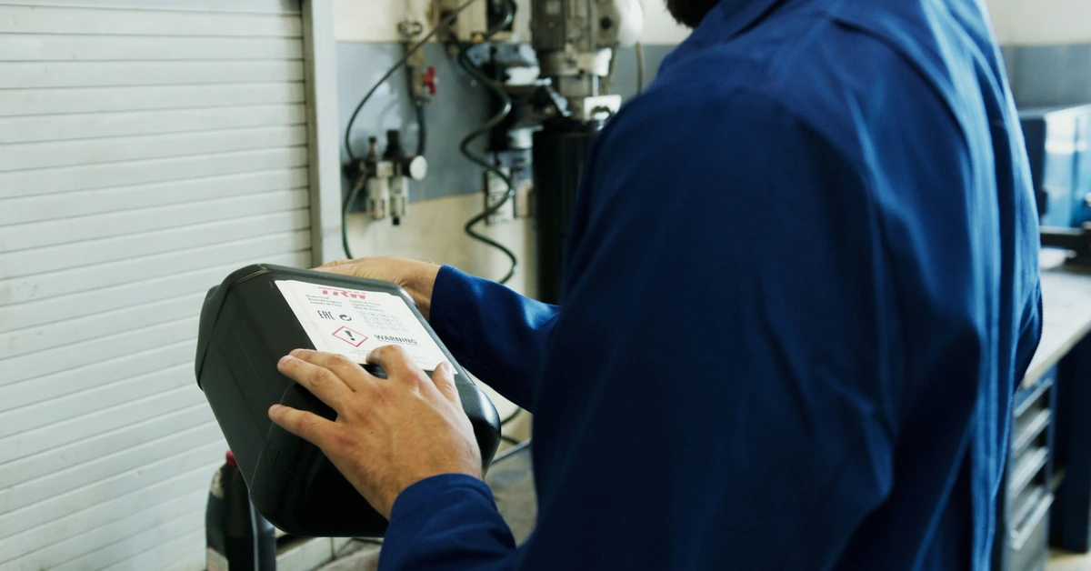 Mechanic inspecting equipment in a workshop, illustrating the process of diagnosing why affiliate clicks are not producing sales.