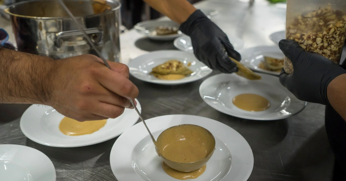 Chefs preparing several dishes as part of one coordinated process, illustrating how multiple affiliate offers can work better when introduced in sequence.