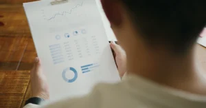 Person reviewing performance charts during a weekly affiliate marketing metrics check.