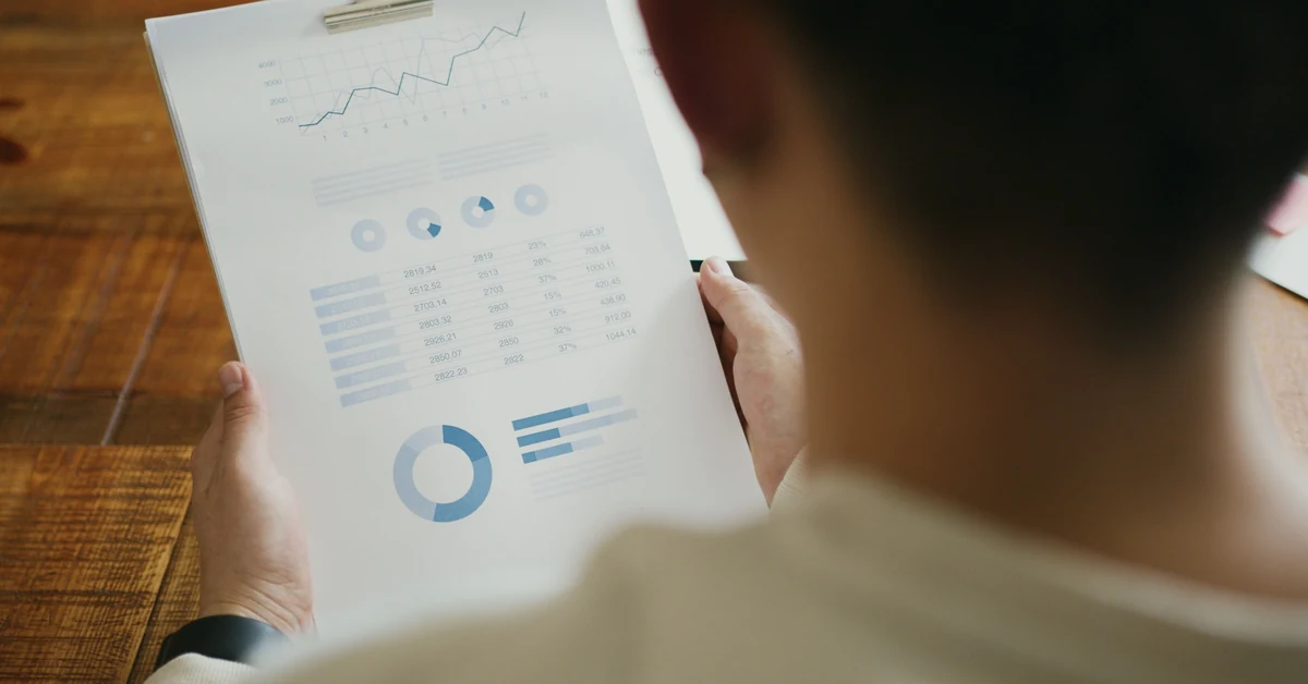 Person reviewing performance charts during a weekly affiliate marketing metrics check.