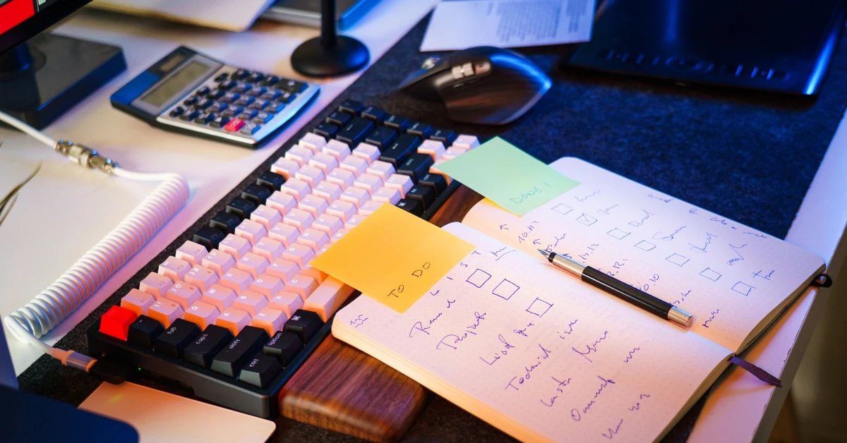 Organized workspace with a notebook and checklist used for a weekly affiliate marketing metrics review.