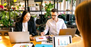 Marketing team reviewing charts and analytics to evaluate the quality of affiliate website traffic