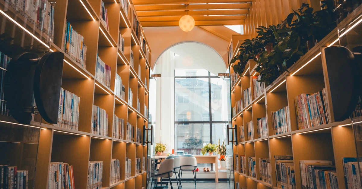 Modern library shelves representing using affiliate marketing training as a reference resource.