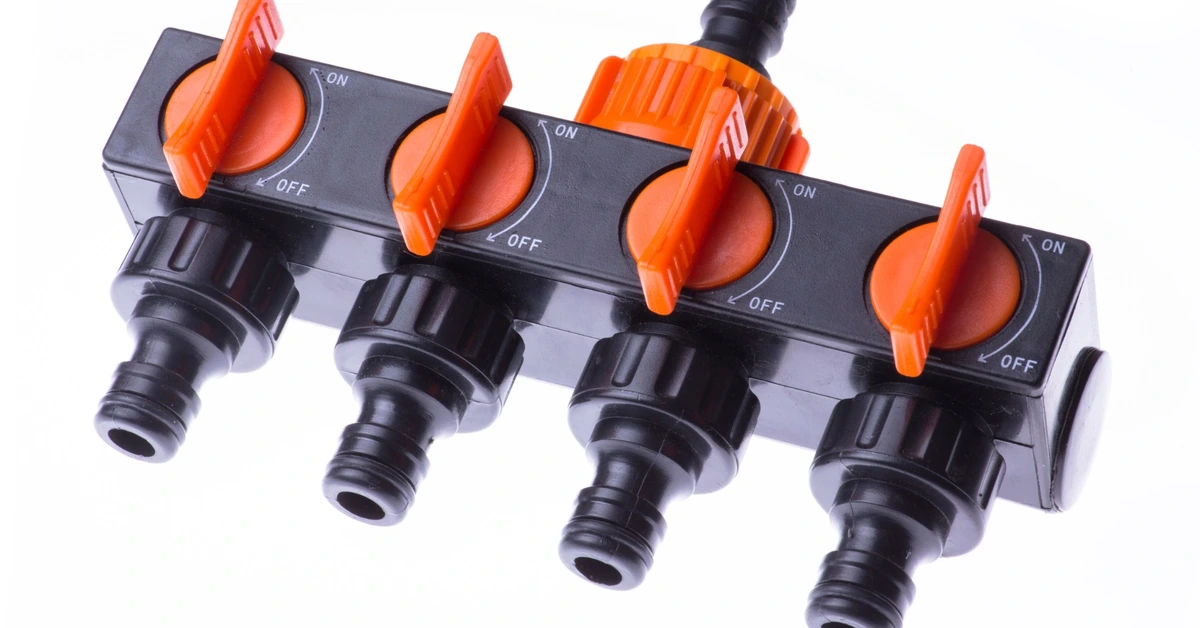 Multi-channel valve manifold splitting one water source into several controlled paths, illustrating how growing email systems may need multiple automations and subscriber journeys.