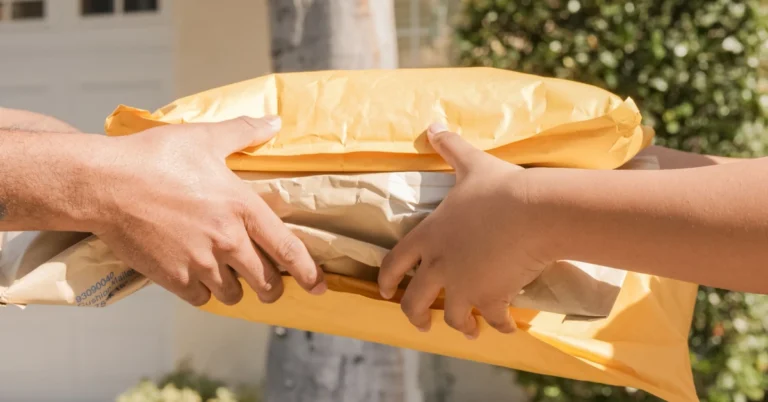 One person handing a package to another, illustrating how the first affiliate email should deliver what was promised.