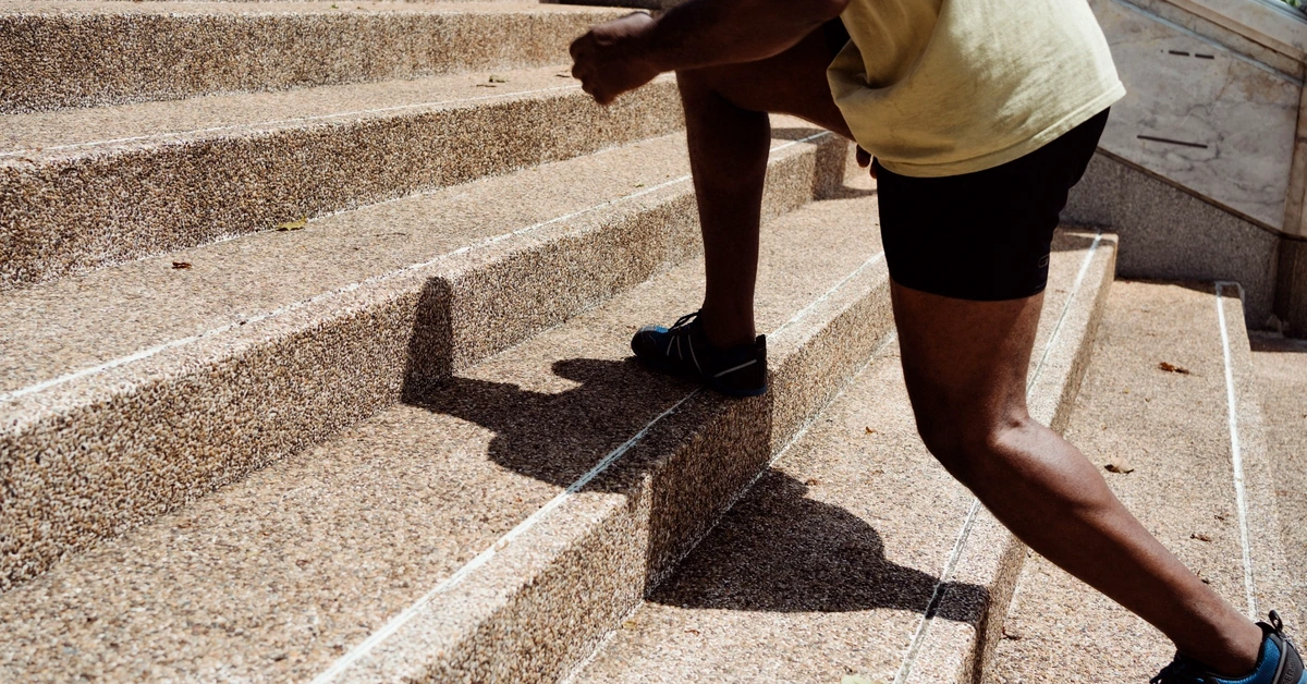 Man climbing outdoor stairs, representing taking the next clear step toward a more structured affiliate marketing system
