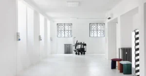 Bright minimalist showroom with open floor space, illustrating a focused environment designed around a specific marketing purpose.