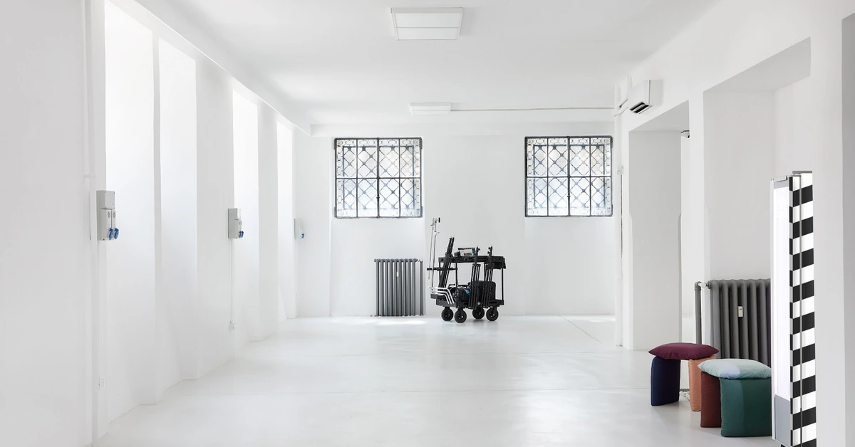 Bright minimalist showroom with open floor space, illustrating a focused environment designed around a specific marketing purpose.