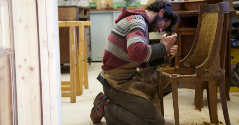 Craftsman restoring an older wooden chair, illustrating how an existing affiliate blog post can be improved instead of replaced.